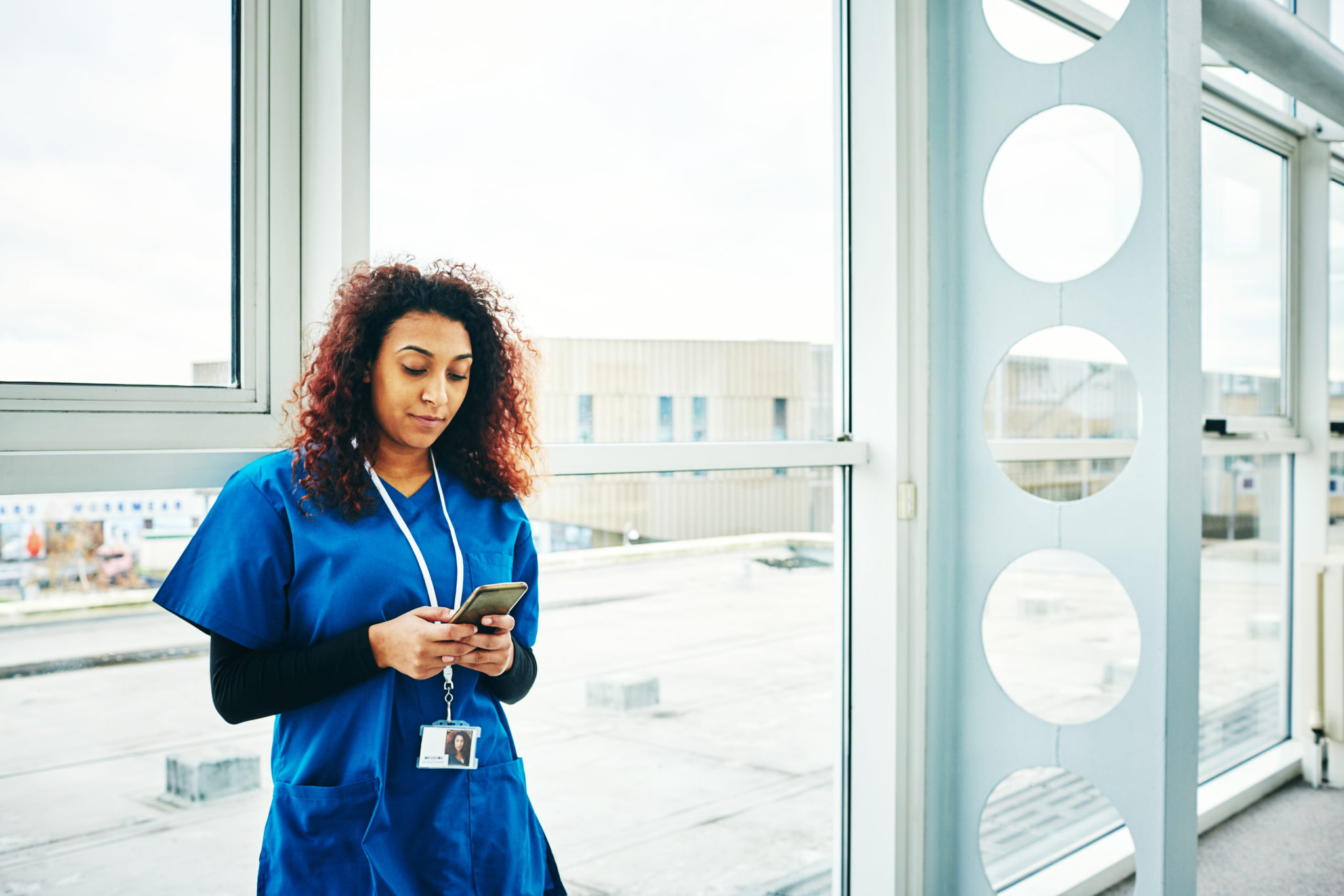 Nurse using mobile phone. Photo Dean Mitchell / Getty Images TUC