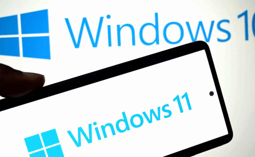 Windows 10 logo on a wall, with a phone displaying Windows 11 logo. Photo: SOPA Images / Contributor / Getty Images