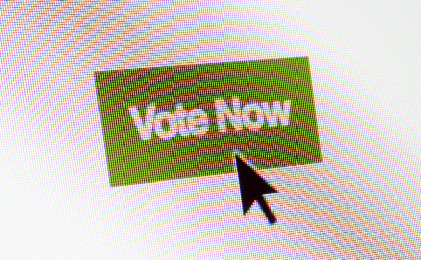 Clicking on a vote button. Photo: Daniel Sambraus / Getty Images